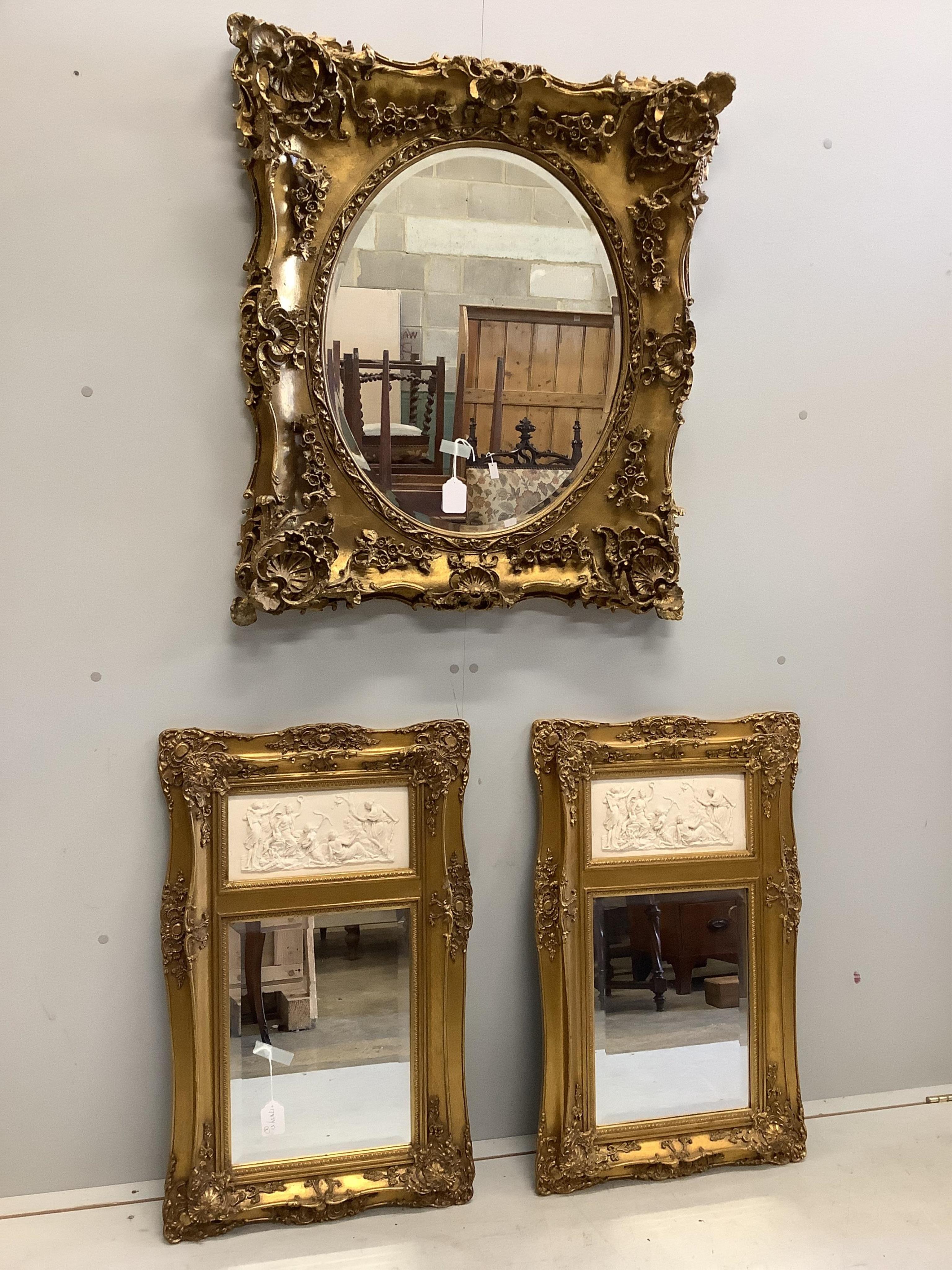 A pair of Victorian style gilt composition and faux marble wall mirrors, width 51cm, height 82cm, together with a similar larger mirror, width 77cm, height 87cm